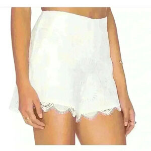 Trina Turk, white shorts, size 6 with beautiful lacing and pockets